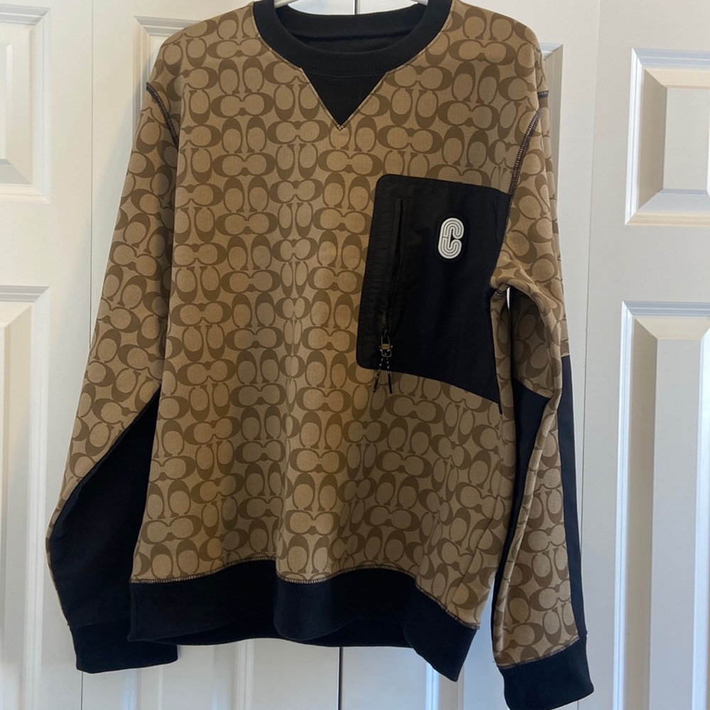 Can’t go wrong with this signature Coach sweatshirt.